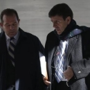 Spanish doctor Eufemiano Fuentes (R) leaves a courthouse on the first day of the high-profile Operacion Puerto doping trial in Madrid, January 28, 2013. REUTERS/Sergio Perez