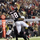 Atlanta Falcons tight end Tony Gonzalez (88) makes a catch for a touchdown as New Orleans Saints middle linebacker Curtis Lofton (50) defends during the first half of an NFL football game, Thursday, Nov. 29, 2012, in Atlanta. (AP Photo/Rich Addicks)
