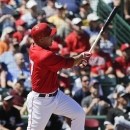 Los Angeles Angels' Mike Trout watches his home run against the Chicago White Sox during the first inning of a spring training baseball game in Tempe, Ariz., Thursday, March 14, 2013. (AP Photo/Chris Carlson)