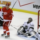 Los Angeles Kings goalie Jonathan Quick (32) looks up as Detroit Red Wings left wing Justin Abdelkader (8) celebrates the goal by teammate center Pavel Datsyuk during the second period of an NHL hockey game in Detroit, Wednesday, April 24, 2013. (AP Photo/Carlos Osorio)