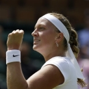 Petra Kvitova of the Czech Republic celebrates after beating Ekaterina Makarova of Russia in their Women's singles match at the All England Lawn Tennis Championships in Wimbledon, London, Saturday, June 29, 2013. (AP Photo/Anja Niedringhaus)