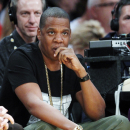 FILE - In this Jan. 27, 2013, file photo, Jay-Z watches an NBA basketball game between the Los Angeles Lakers and Oklahoma City Thunder in Los Angeles. New York Yankees' Robinson Cano plans to switch agents from Scott Boras to a new company formed by musician Jay-Z's Roc Nation and CAA Sports. (AP Photo/Reed Saxon, File)
