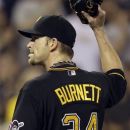 Pittsburgh Pirates pitcher A.J. Burnett acknowledges the cheers as he walks to the dugout after being pulled in the seventh inning of a baseball Miami Marlins in Pittsburgh Saturday, July 21, 2012.  (AP Photo/Gene J. Puskar)