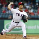 Texas Rangers starting pitcher Yu Darvish, of Japan, delivers to the Tampa Bay Rays in the first inning of a baseball game, Tuesday, Aug. 28, 2012, in Arlington, Texas. (AP Photo/Tony Gutierrez)
