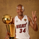 MIAMI, FL - JUNE 20: Ray Allen #34 of the Miami Heat poses for a portrait with the Larry O'Brien Trophy after defeating the San Antonio Spurs in Game Seven of the 2013 NBA Finals on June 20, 2013 at American Airlines Arena in Miami, Florida. (Photo by Andrew D. Bernstein/NBAE via Getty Images)