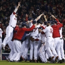 Boston Red Sox players celebrate after defeating the St. Louis Cardinals in Game 6 of baseball's World Series Wednesday, Oct. 30, 2013, in Boston. The Red Sox won 6-1 to win the series. (AP Photo/Elise Amendola)