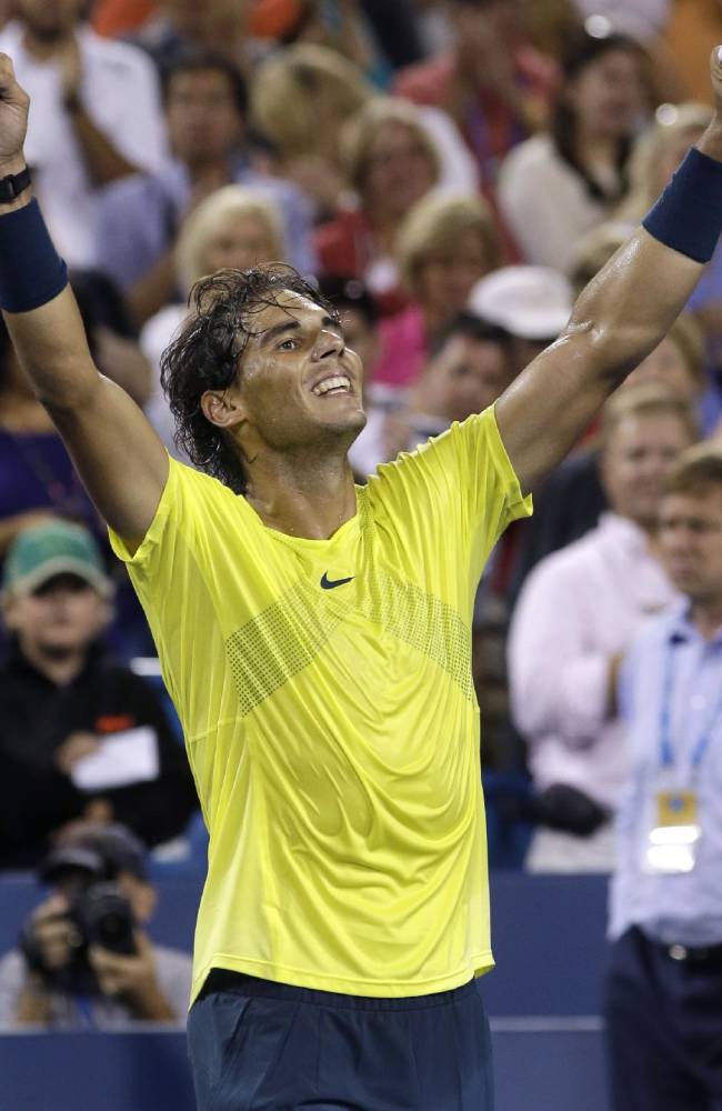 Rafael Nadal, of Spain, celebrates after defeating Roger Federer, from Switzerland, 5-7, 6-4, 6-3, during a quarterfinal at the Western & Southern Open tennis tournament, Friday, Aug. 16, 2013, in Mason, Ohio