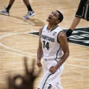 Michigan State's Gary Harris celebrates after Purdue called a timeout after Harris hit a 3-pointer during the first half of an NCAA college basketball game, Saturday, Jan. 5, 2013, in East Lansing, Mich. (AP Photo/Al Goldis)