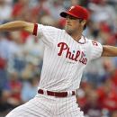 Philadelphia Phillies starting pitcher Cole Hamels throws against the Atlanta Braves in the first inning of a baseball game, Tuesday, Aug. 7, 2012, in Philadelphia. (AP Photo/H. Rumph Jr)