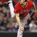 Los Angeles Angels starting pitcher Dan Haren follows through on a pitch against the Seattle Mariners in the eighth inning in a baseball game Thursday, May 24, 2012, in Seattle. (AP Photo/Elaine Thompson)