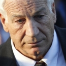 FILE - In this Dec. 13, 2011 file photo, former Penn State assistant football coach Jerry Sandusky arrives for a preliminary hearing at the Centre County Courthouse in Bellefonte, Pa. Sandusky said in interview excerpts broadcast Monday, March 25, 2013 that a key witness against him misinterpreted him showering with a young boy in Penn State football team facilities more than a decade ago. (AP Photo/Matt Rourke, File)