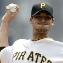 Pittsburgh Pirates pitcher Charlie Morton throws in the first inning of a baseball game against the New York Mets in Pittsburgh, Wednesday, May 23, 2012. (AP Photo/Gene J. Puskar)