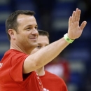Louisville head coach Jeff Walz waves during practice at the Women's Final Four of the NCAA college basketball tournament, Saturday, April 6, 2013, in New Orleans. Louisville plays California in a semifinal game on Sunday. (AP Photo/Dave Martin)