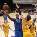 Dallas Mavericks' Eddy Curry (52) shoots against Los Angeles Lakers' Pau Gasol (16), of Spain, in the first half of an NBA basketball game in Los Angeles, Tuesday, Oct. 30, 2012. (AP Photo/Jae C. Hong)
