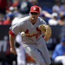 St. Louis Cardinals third baseman David Freese handles a grounder hit by New York Mets' Marlon Byrd during the fifth inning of an exhibition spring training baseball game Thursday, March 21, 2013, in Port St. Lucie, Fla. The Cardinals won 3-2. AP Photo/Jeff Roberson)