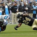 Carolina Panthers' Brandon LaFell (11) is upended by New Orleans Saints' Corey White (24) during the second quarter of an NFL football game in Charlotte, N.C., Sunday, Sept. 16, 2012. (AP Photo/Rainier Ehrhardt)