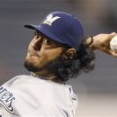 Milwaukee Brewers starting pitcher Yovani Gallardo throws to the Pittsburgh Pirates in the first inning of a baseball game in Pittsburgh on Tuesday, Sept. 18, 2012. (AP Photo/Keith Srakocic)