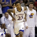 Kansas guard Ben McLemore (23) celebrates a 3-pointer during the second half of an NCAA college basketball game against West Virginia in Lawrence, Kan., Saturday, March 2, 2013. McLemore scored 36 points in the game. Kansas defeated West Virginia 91-65. (AP Photo/Orlin Wagner)