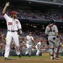 Washington Nationals' Jayson Werth crosses home as Bryce Harper follows behind to score on Adam LaRoche's two-RBI single during the first inning of a baseball game against the St. Louis Cardinals at Nationals Park Friday, Aug. 31, 2012, in Washington. (AP Photo/Alex Brandon)