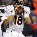 Denver Broncos quarterback Peyton Manning (18) looks for a receiver against the Chicago Bears during the first half of an NFL preseason football game in Chicago, Thursday, Aug. 9, 2012. (AP Photo/Michael Conroy)