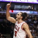 Chicago Bulls center Joakim Noah reacts after scoring and getting fouled during the second half of an NBA basketball game against the Sacramento Kings, Wednesday, Oct. 31, 2012, in Chicago. The Bulls won 93-87. (AP Photo/Charles Rex Arbogast)