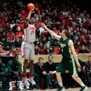 New Mexico's Tony Snell shoots and scores three of his game-high 23 points against Colorado State's Pierce Hornung in the first half of their NCAA college basketball game in Albuquerque, N.M., Wednesday, Jan. 23, 2013. New Mexico won 66-61. (AP Photo/Eric Draper)