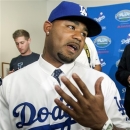 Los Angeles Dodgers' Carl Crawford talks to reporters during news conference for his introduction as the new outfielder for the the Dodgers, in Los Angeles on Friday, Oct. 26, 2012. Crawford was acquired by the Dodgers in August from the Boston Red Sox in a trade along with players Adrian Gonzalez, Josh Beckett, and Nick Punto. (AP Photo/Damian Dovarganes)