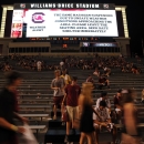South Carolina fans file out of the stands during the second half of an NCAA college football game after school officials suspended the game against North Carolina due to severe weather, Thursday, Aug. 29, 2013, in Columbia, S.C. (AP Photo/Stephen Morton)