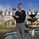 Europe Ryder Cup team golfer Paul Lawrie poses with the Ryder Cup during a photocall in front of the Gleneagles Hotel, the venue for the 2014 Ryder Cup, in Scotland October 3, 2012. The photocall officially started the countdown for Ryder Cup 2014 at Gleneagles. REUTERS/David Moir