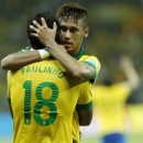 Brazil's Paulinho, left, is congratulated by his teammate Neymar after scoring his side's 2nd goal during the soccer Confederations Cup semifinal match between Brazil and Uruguay at the Mineirao stadium in Belo Horizonte, Brazil, Wednesday, June 26, 2013. (AP Photo/Bruno Magalhaes)
