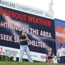An unidentified spectator reacts to the announcement of a weather delay during the second round of the Travelers Championship golf tournament in Cromwell, Conn., Friday, June 22, 2012. (AP Photo/Fred Beckham)