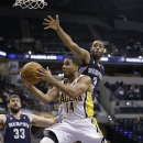 Indiana Pacers' D.J. Augustin (14) puts up as shot against Memphis Grizzlies' Wayne Ellington during the second half of an NBA preseason basketball game, Saturday, Oct. 20, 2012, in Indianapolis. Indiana defeated Memphis 83-80. (AP Photo/Darron Cummings)