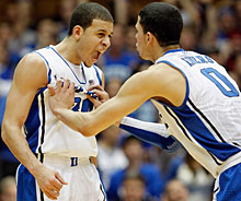 Seth Curry and Austin Rivers celebrate.