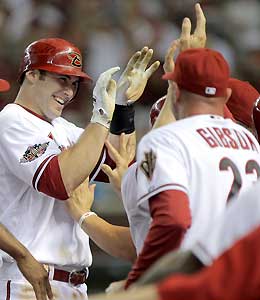 Paul Goldschmidt (left) celebrates at the dugout after hitting a grand slam in the fifth inning off pitcher Shaun Marcum of the Brewers.