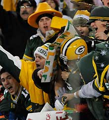 The Packers' Jordy Nelson is embraced by fans in the stands after catching a TD pass in the second half.