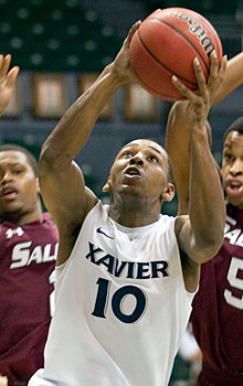 Mark Lyons and No. 14 Xavier snapped a three-game losing streak with a victory over Southern Illinois in the Diamond Head Classic.