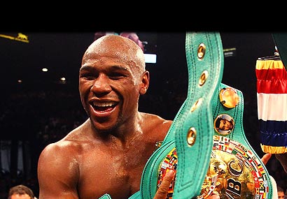 Floyd Mayweather Jr. celebrates after defeating Miguel Cotto by unanimous decision.