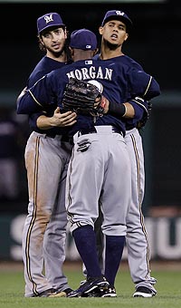 Nyjer Morgan (center) is embraced by teammates after the Brewers' win Thursday.