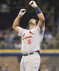 The Cardinals' Albert Pujols reacts after hitting a ground-rule double in the top of the seventh inning against the Brewers.