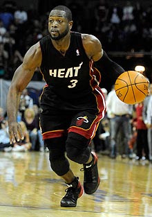 Miami Heat guard Dwyane Wade, who scored 10 points, missed most of the third quarter with a bruised foot.