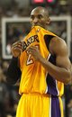 Los Angeles Lakers guard Kobe Bryant holds his jersey in his mouth  in the closing moments of the Lakers loss to the Sacramento Kings in the NBA basketball game in Sacramento, Calif.,  Dec. 26, 2011.  The Kings won 100-91.