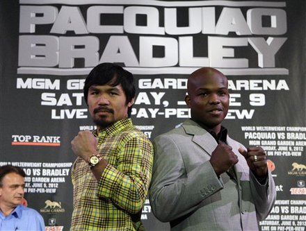 Manny Pacquiao, Left, Of The Philippines, And Timothy Bradley Jr. Pose At A News