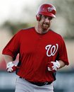 Washington Nationals ' Chad Tracy rounds the bases after hitting a two-run home run against the Atlanta Braves in the fourth inning of a spring training baseball game in Kissimmee, Fla., Wednesday, March 14, 2012.