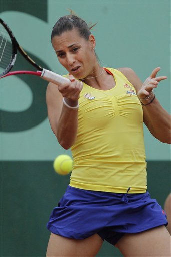 Flavia Pennetta of Italy returns in her second round match against Alexa 