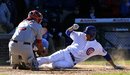 Washington Nationals catcher Wilson Ramos , left, tags out Chicago Cubs ' Joe Mather , during the ninth inning of a baseball game, Thursday, April 5, 2012, in Chicago.