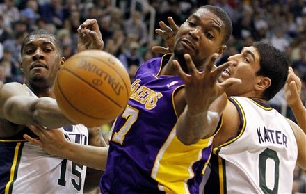 Los Angeles Lakers Center Andrew Bynum (17) Loses The Ball As He Is Defended By Utah Jazz Center Derrick Favors (15)
