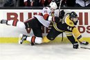 Ottawa Senators left wing Zack Smith (15) and Boston Bruins defenseman Dennis Seidenberg (44) of Germany grapple along the boards during the first period of an NHL hockey game in Boston Tuesday, Feb. 28, 2012. Ottawa won 1-0.
