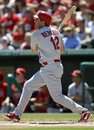 St. Louis Cardinals first baseman Lance Berkman hits a double in the first inning of a spring training baseball game against the Miami Marlins in Jupiter, Fla., Friday, March 23, 2012. St. Louis won 2-1.