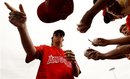 Los Angeles Angels starting pitcher Jered Weaver signs before a spring training baseball game against the Texas Rangers in Tempe, Ariz., Sunday, March 25, 2012.