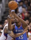 Oklahoma City Thunder forward Kevin Durant , right, battles Los Angeles Clippers forward Caron Butler for a loose ball during the first half of an NBA basketball game in Los Angeles, Monday, Jan. 30, 2012.